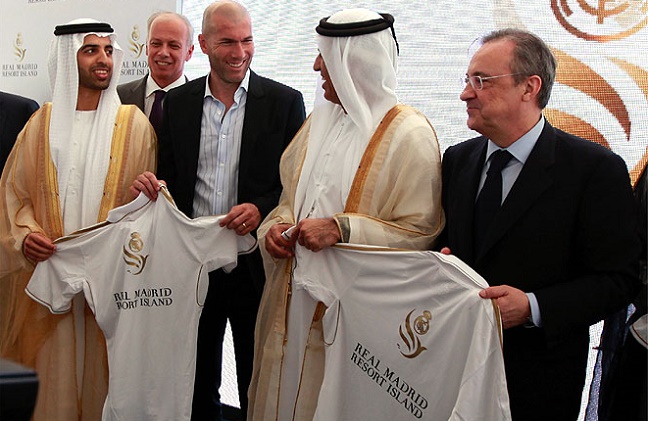 Zidane laughs with Ruler of Ras Al Khaimah Sheikh Saud  and Real Madrid President Perez after a news conference for the club resort island in Ras Al Khaimah